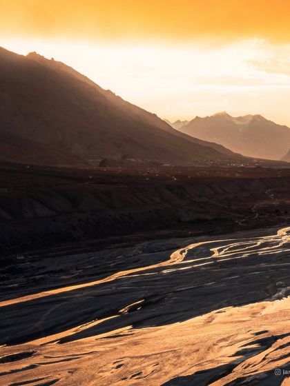A more subtle take on the Spiti sunset, focusing on the soft light and long shadows across the riverbed. This shot conveys a feeling of peace and tranquility at the end of the day.