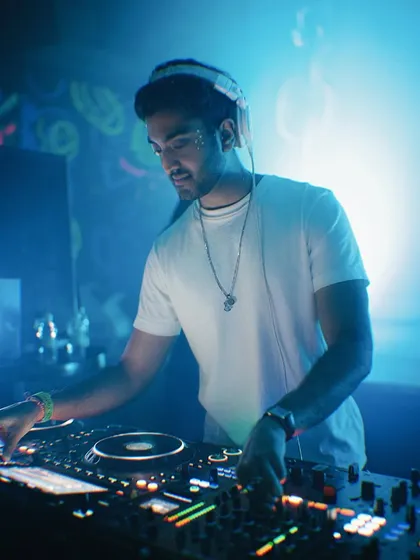 Locked in and focused. A shot of me in my element, mixing tracks during a high-energy club set. This is where I blend different genres to create a unique vibe for the night.