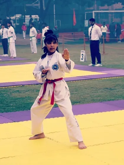 One of my students demonstrating focus and precision during an individual Tul, or pattern, competition. We train for sharp, powerful movements that meet the strict criteria of ITF judges.