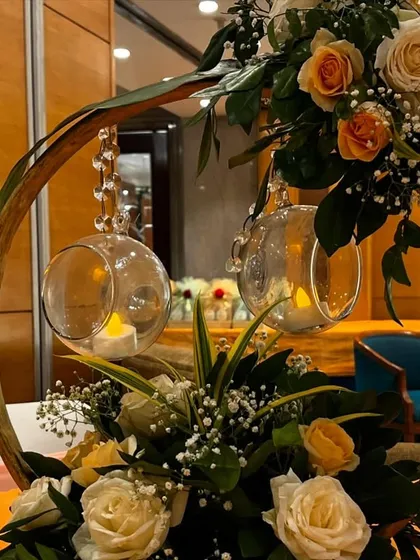 Another variation of the ring centerpiece, this time with peach and white roses, designed for an event at Jaypee Siddharth.