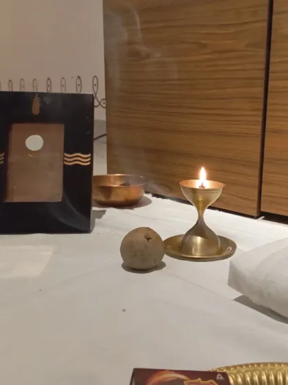 A single flame and an offering. In this consecrated space, even the simplest acts become a way to connect and express our gratitude.
