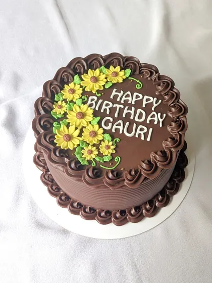 A little bit of sunshine with a whole lot of chocolate. This rich chocolate cake is decorated with bright yellow buttercream sunflowers.