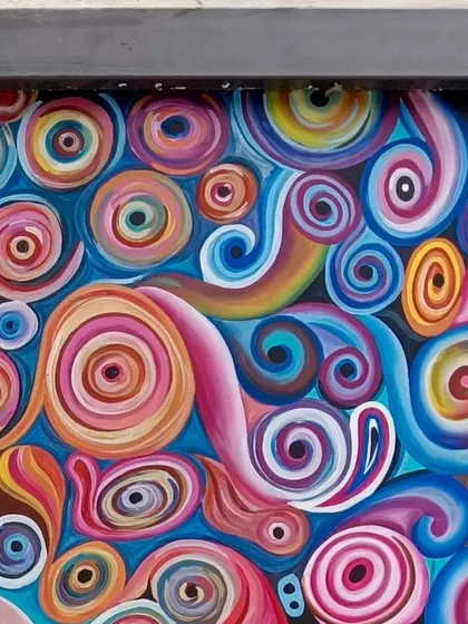 This section highlights the cool blue and purple tones used in the abstract mural.