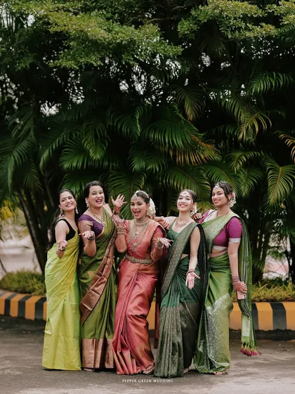 A joyful group photo of the bride and her bridesmaids, their laughter and energy captured perfectly.