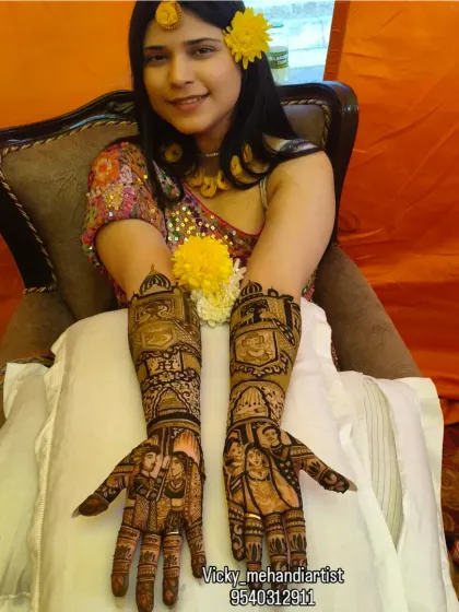 A bride's happy smile is my greatest reward. Here you can see the full effect of a complete bridal mehndi, with detailed work covering the hands and arms, perfectly complementing her wedding glow.