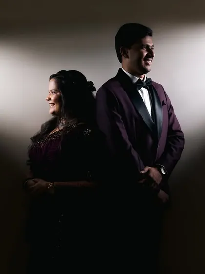 A dramatic and stylish portrait of the couple using creative lighting. Perfect for capturing the mood of an evening reception.