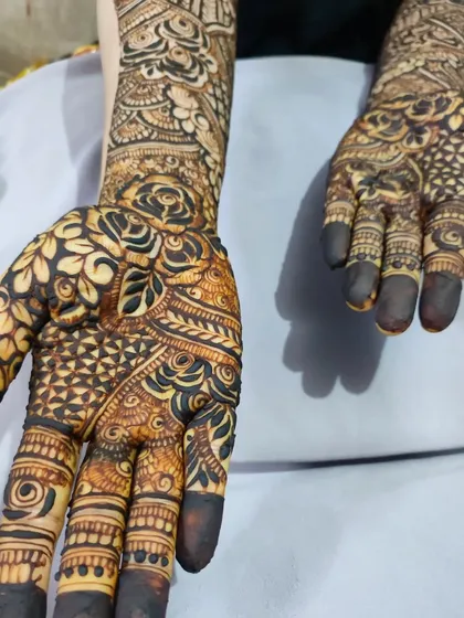 A close-up of a floral bridal palm, where the design is most concentrated and detailed.