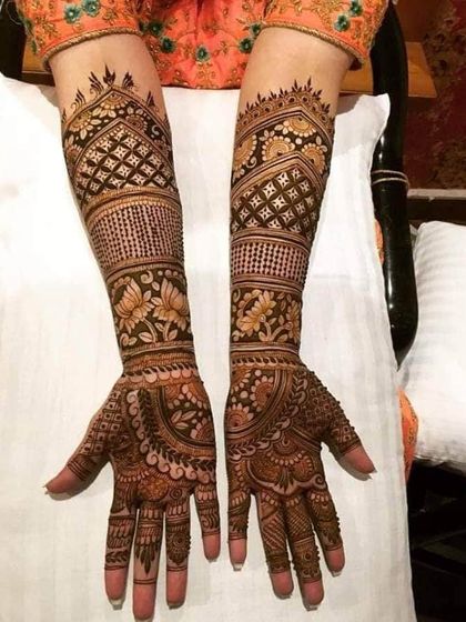 This elegant bridal design features beautiful lotus motifs and intricate jaali work, demonstrating our skill in creating detailed and traditional patterns.