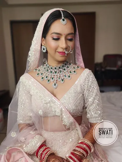 Kshitija looking ethereal in her pastel pink and white lehenga. This modern bridal look is perfect for a bride who wants something unique.