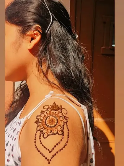 The final result of the mandala shoulder tattoo, a stunning piece of body art.