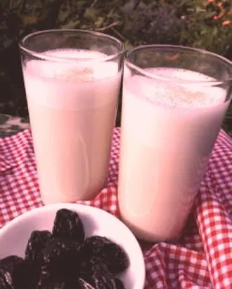 Two glasses of my nutrient-packed Sesame Almond Latte, served with dates. This plant-based milk is incredibly rich in calcium and is a wonderful, healthy alternative to dairy.