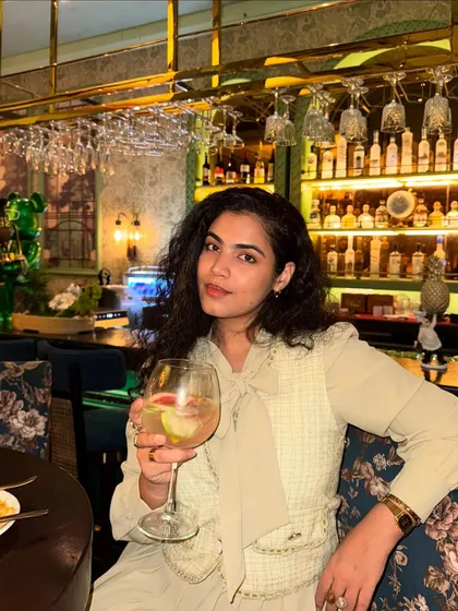 Served and ate. A snapshot from a sushi dinner in Delhi. I’m wearing a chic, monochrome beige outfit with a pleated dress and a tweed waistcoat. This is a great example of a sophisticated dinner look.