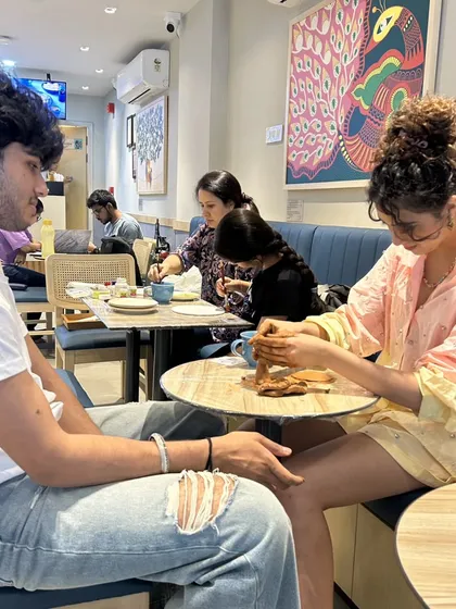 A couple enjoying a workshop together. It's a great way to connect and do something different.