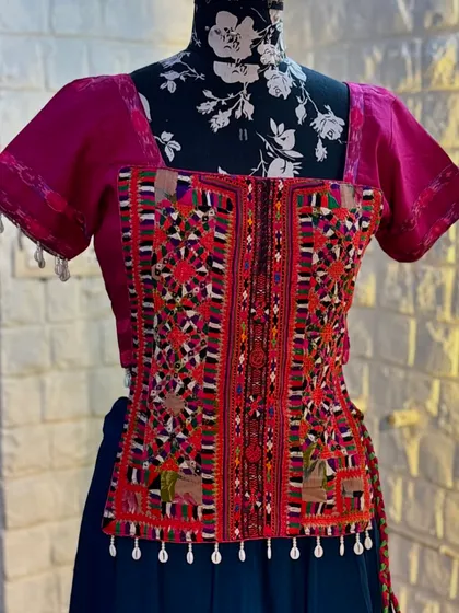 A close-up of the hand-embroidered blouse.