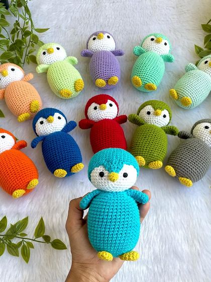 A rainbow of penguin babies! I made this colorful flock as return gifts for a birthday party. Each penguin is a different color, making them a unique and memorable party favor.