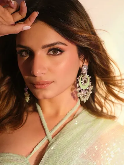 A soft and radiant glam look I created for the talented singer Prakriti Kakar. The makeup features a warm, neutral eye, glowing skin, and a subtle lip, showing how versatile my makeup style can be for different events and personalities.