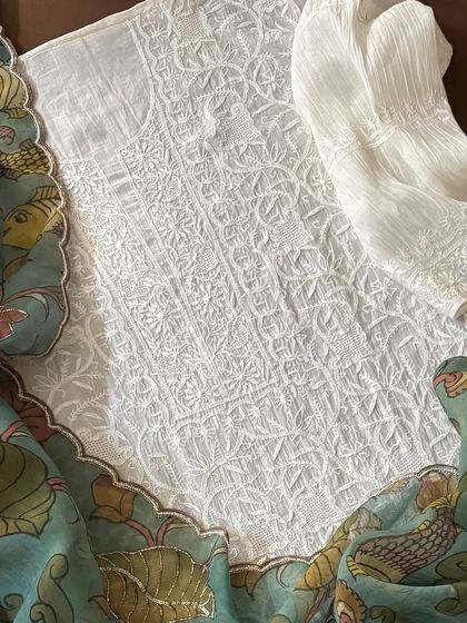 A detail shot of the Chikankari kurta fabric, showing its dense jaal work, paired with the Kalamkari dupatta.