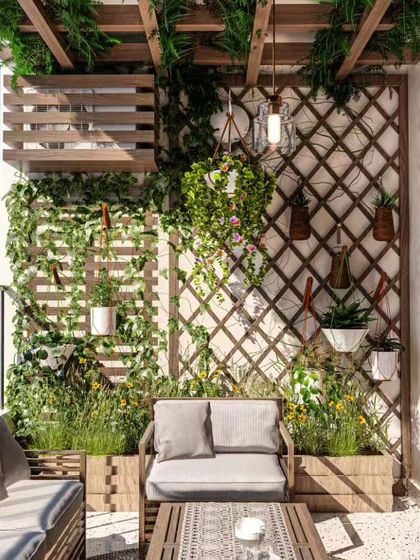 This balcony design uses wooden trellises and planters to create a lush, green enclosure. The comfortable grey sofa makes it an ideal outdoor living room for relaxing or entertaining.