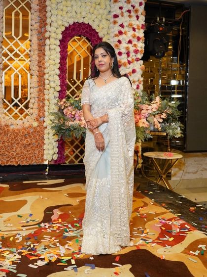 The client at the event, looking radiant.