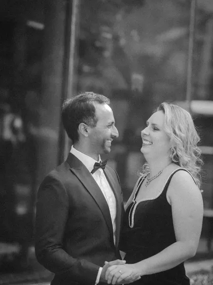A candid black and white shot filled with genuine laughter. This pre-wedding photo perfectly captures the fun and easygoing nature of their relationship.
