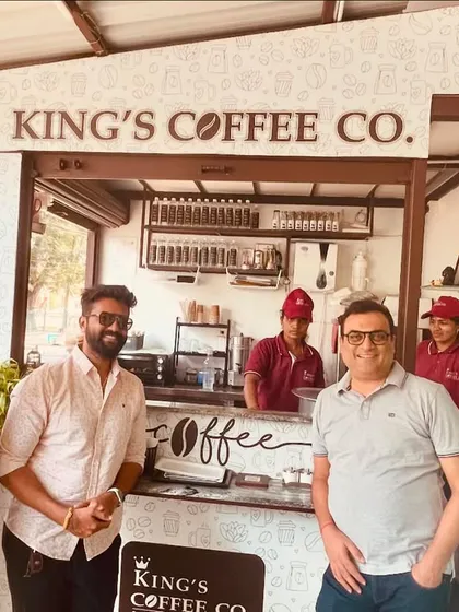 Our team with the founders of King's Coffee Co. at their original kiosk. This image shows the beginning of a success story that we are now helping to scale into a national franchise.