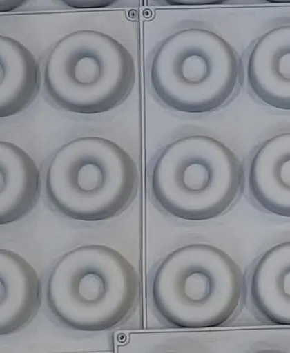 A multi-cavity silicone mold for making small donut-shaped soaps or wax melts. The uniform design is great for producing consistent batches.