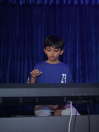 Even our youngest pianists take the big stage. This student shows incredible focus playing his part for the band at our annual concert.