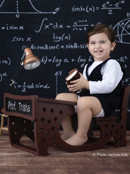 A playful moment at the professor's desk. We encourage kids to interact with the props for natural and candid shots.