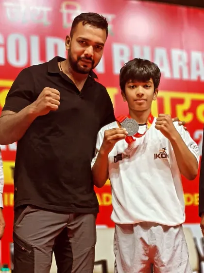 The proof is in the results. Here is one of my young champions with his medal after a tough competition. We don't just train, we build winners inside and outside the ring.