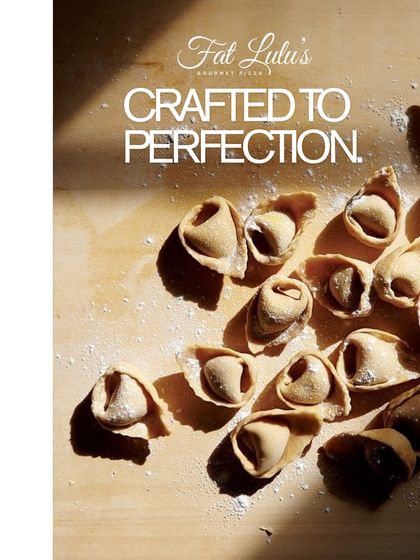 Crafted to perfection. This close-up shot shows our handmade tortellini, dusted with flour and ready to be cooked. It's a testament to the care we put into our pasta.