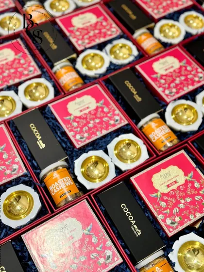 A vibrant array of gift boxes ready for a celebration. This image showcases the variety of items I can curate, from gourmet foods to traditional diyas, all packed with care and precision for bulk orders.