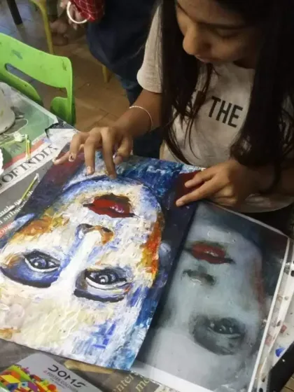 Here, a young student is learning to create a portrait using a reference image. The process of observing, sketching, and applying color is a journey in itself. It is about enjoying every moment of creation.