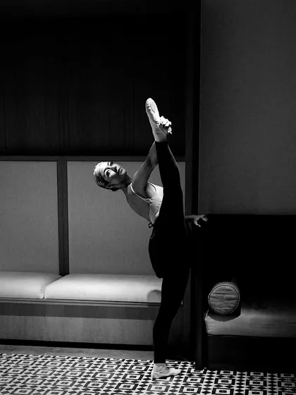 My personal practice is the foundation of my teaching. This moment of a standing split shows the dedication and technical skill I've developed over years of training. I bring this same focus on discipline and body awareness to my students, helping them understand what their bodies are capable of.