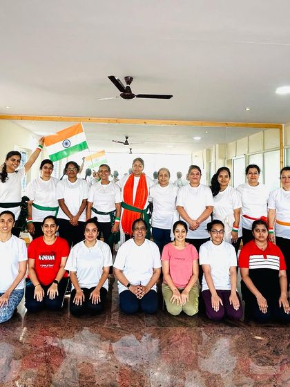 A proud group photo from our Independence Day celebration. It's wonderful to see everyone come together with such patriotic spirit.