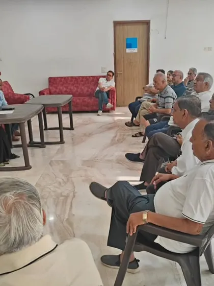 An engaged group of senior citizens listening intently during the digital safety workshop. The high participation shows a real need for this kind of specialized legal awareness in our communities.
