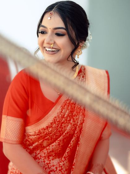 A candid shot of the bride, her makeup looking natural and fresh.