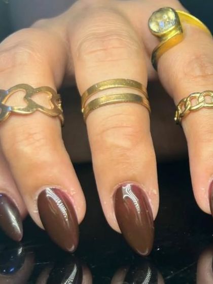 Another look at the glossy dark brown almond nails.