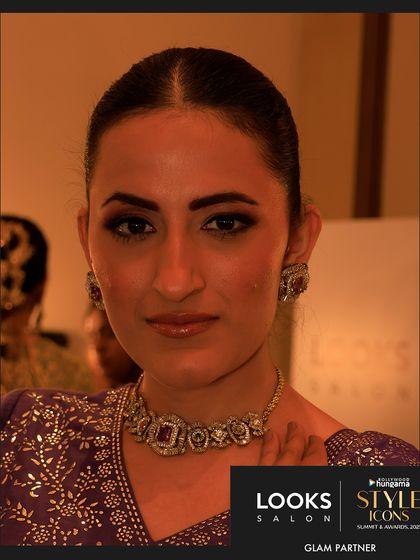 A close-up of a guest styled by my team for the awards night. The makeup is glamorous yet refined, showcasing a smoky eye and flawless skin that is perfect for a red carpet event.