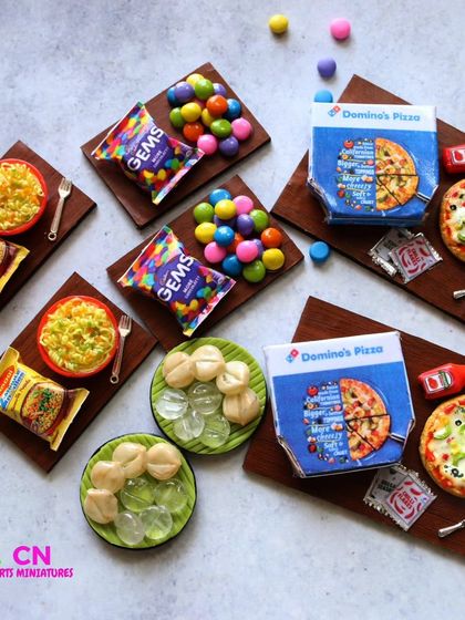 A collection of my fast food and snack miniatures, including Maggi, pizza, and Gems.