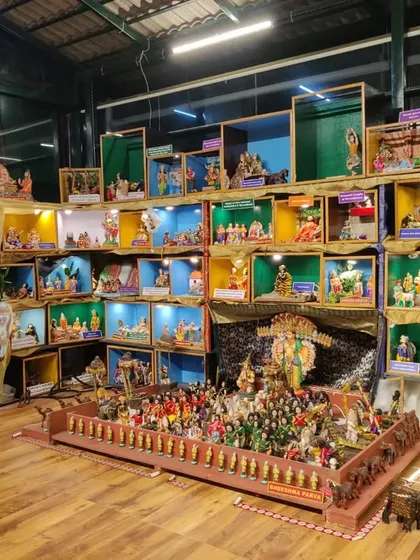 This image showcases the variety within our doll displays. In the foreground, a large display depicts an army formation, while tiered boxes in the background each contain a unique scene, demonstrating the depth of our collection.