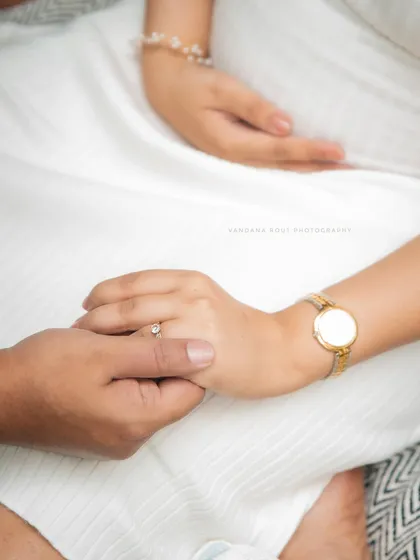 A sweet and playful picnic setup is a wonderful way to announce your joy. This maternity shoot uses props like a "Coming Soon" sign to add a personal and fun touch.