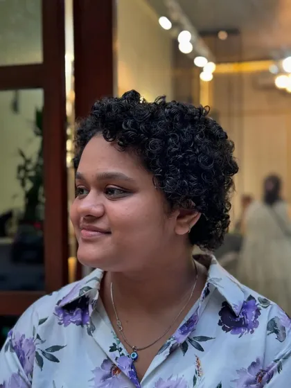 The amazing result after a hydrating curl definition service. By using the right techniques and products, I transformed her hair into beautifully defined, moisturized curls, showcasing the versatility and health of her natural hair.