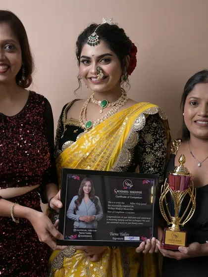 Another proud graduate receiving her certificate. She created a stunning yellow Maharashtrian look for her final exam.