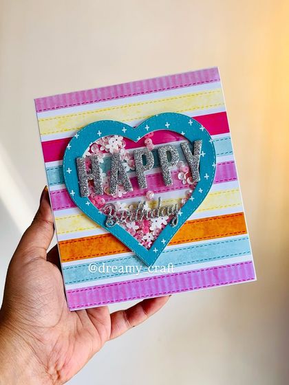 The cover of the pop-up card, featuring a colorful shaker heart with "Happy Birthday" in glittery letters. It's a fun preview of the memories inside.