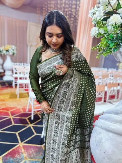 Draping my mother's wedding saree. It's a piece of my own history and a constant source of inspiration, reminding me of the emotional power of clothing.