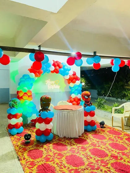The full setup for the superhero birthday party, perfect for action-loving kids, arranged in a community hall space.