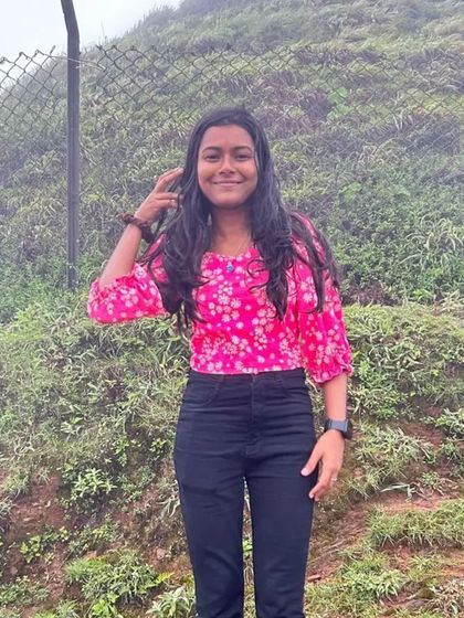 A solo traveler enjoying the view from a viewpoint in Chikmagalur.