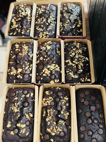 A fresh batch of my wholewheat jaggery Belgian chocolate tea cakes, ready to be shipped out. I bake them in these eco-friendly loaf pans, perfect for gifting or enjoying at home.