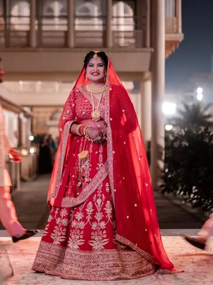 A stunning bridal portrait where the bride is the calm center amidst the motion of guests, creating a dynamic and focused image.