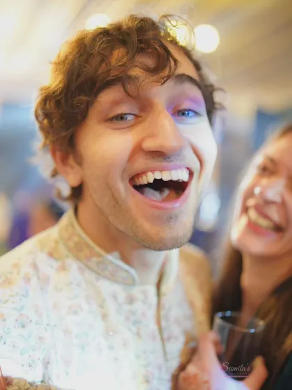 A guest's infectious laugh. I'm always looking for these moments of pure, unscripted happiness that fill a wedding celebration.